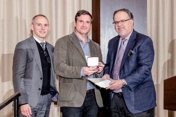 Tiago accepting Pfizer award